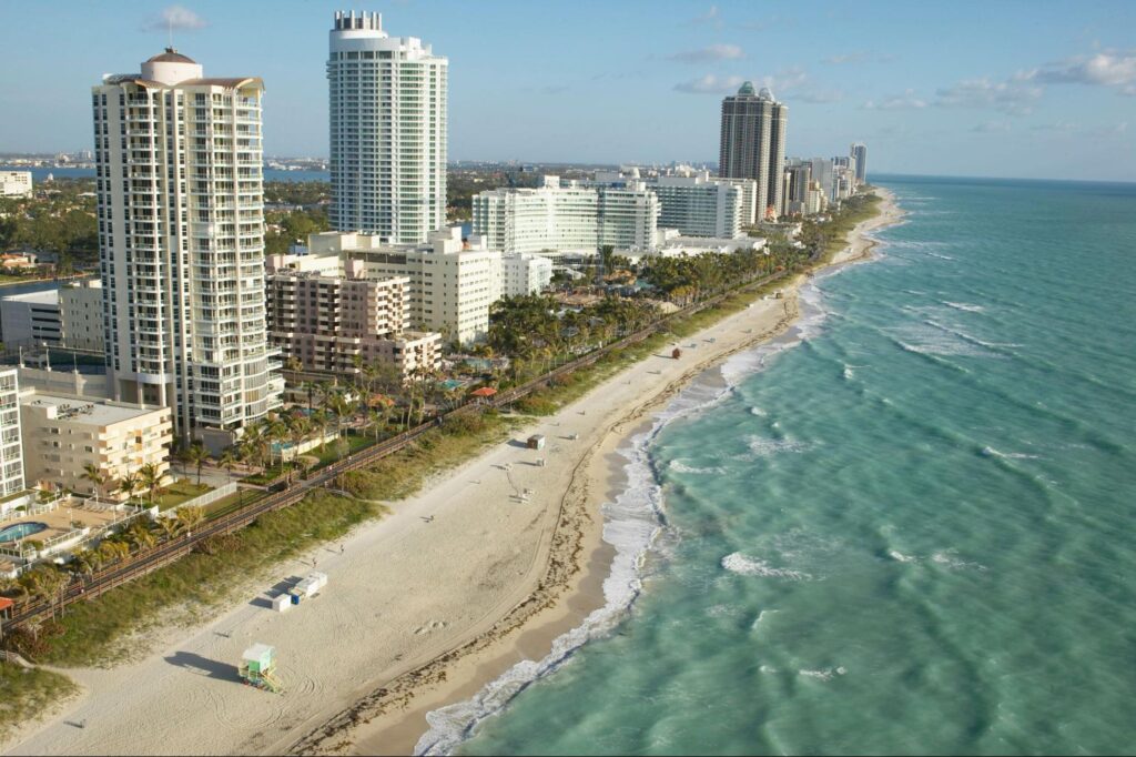 Aerial view of luxury waterfront high-rise condos along Clearwater Beach near Mandalay Point in Tampa Bay